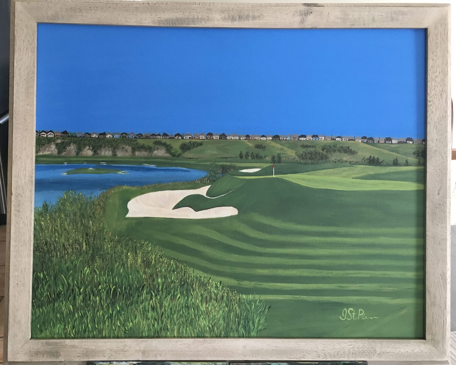 Painting of a golf course green and sand trap with pond in the background