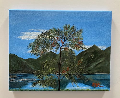 Painting of a leafy tree in front of a lake with mountains in the background