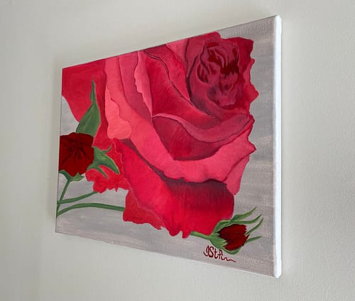 Close up painting of a bright red rose in bloom