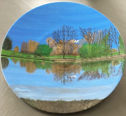 Bright pond scene painting on a large round 17" plate