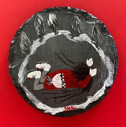 Coaster with a painting of a girl in a red jacket falling while skating on it