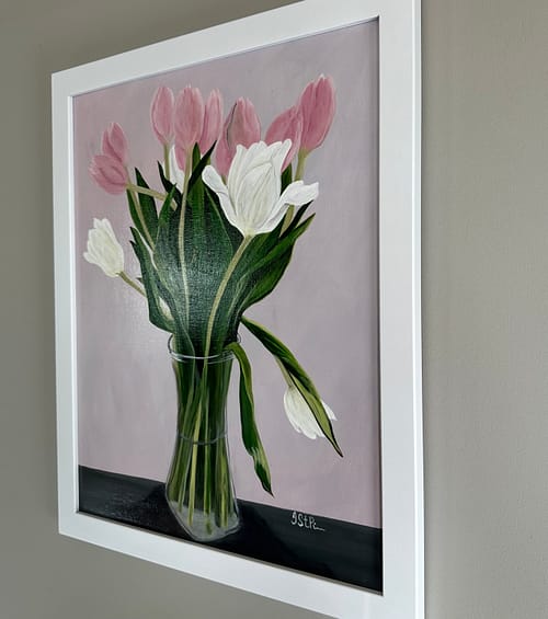 A painting of pink and white tulips in a clear vase