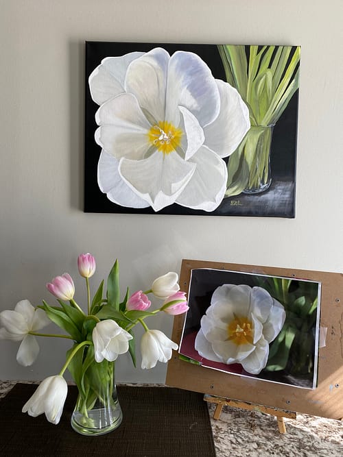 A painting of a large open white tulip reaching out from a glass vase